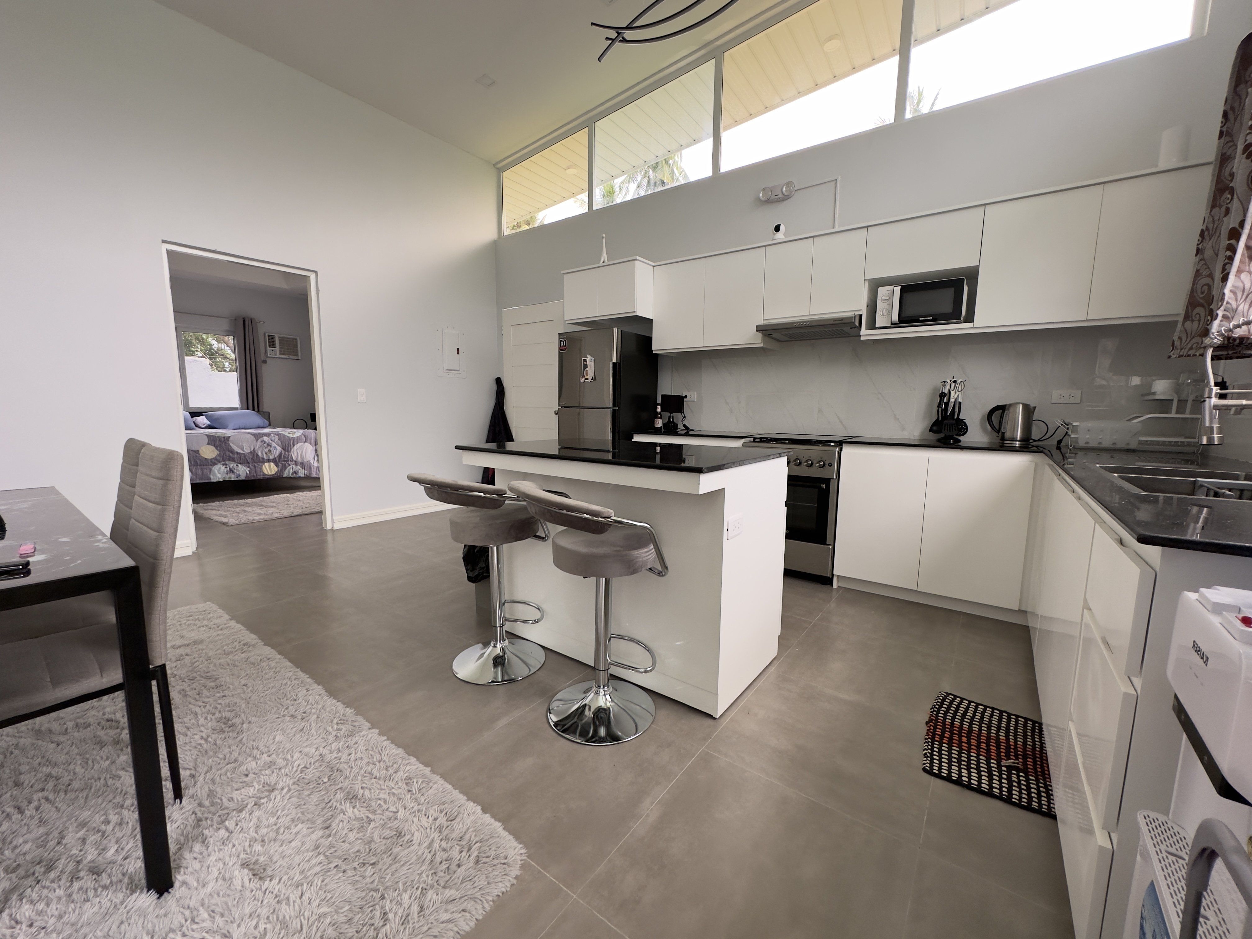 Kitchen island with bedroom beyond